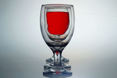 Close-up of red wine glass on table