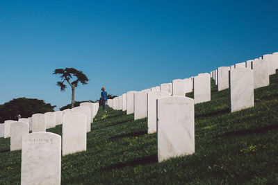 Low angle view of cemetery against clear sky