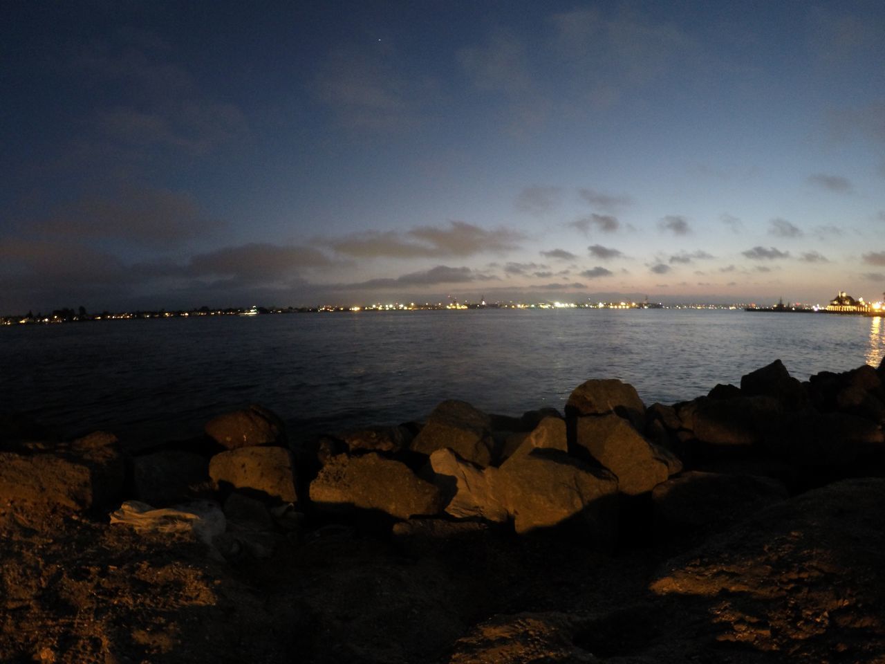 water, sea, sky, rock - object, scenics, tranquil scene, beauty in nature, tranquility, beach, shore, nature, horizon over water, cloud - sky, dusk, idyllic, sunset, outdoors, rock formation, rock, coastline