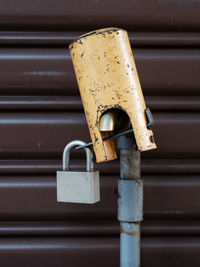 Close-up of padlock on metal