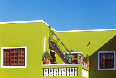 Low angle view of house against clear blue sky