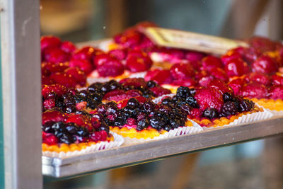 Close-up of fruits dessert in display cabinet at store