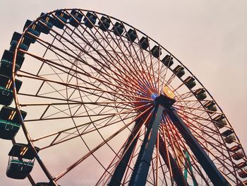 Low angle view of ferris wheel against sky