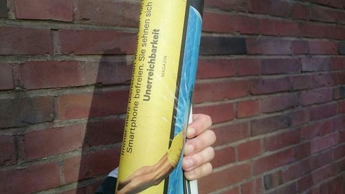 Close-up of text on brick wall