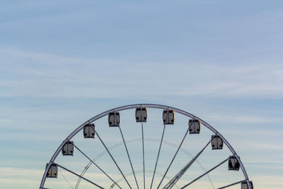 Low angle view of ferris wheel against sky