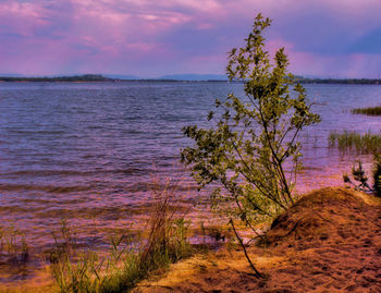 Scenic view of sea against sky at sunset