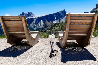 High angle view of woman on snowcapped mountains during sunny day