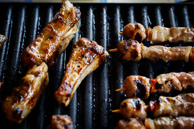 Close-up of meat on barbecue grill
