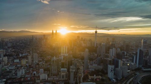 Aerial view of cityscape during sunset