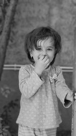 Portrait of cute girl standing outdoors