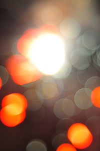 Defocused image of illuminated lights at night