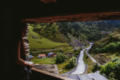 High angle view of woman on road amidst trees