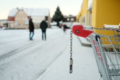 Close-up of shopping cart on snow