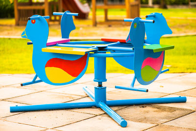 Multi colored chairs in park