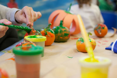 Close-up of person preparing food on table