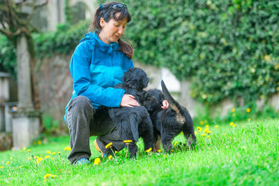 Woman with dog on grass