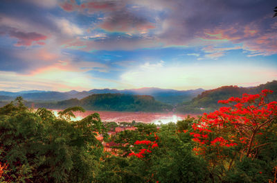Scenic view of mountains against cloudy sky