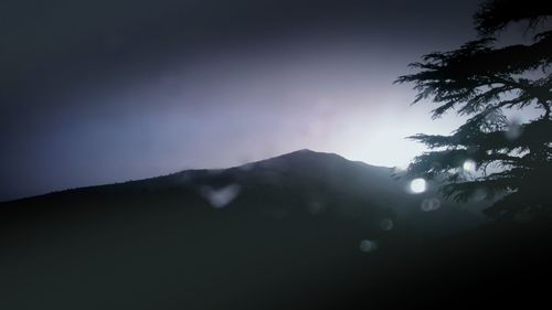 Low angle view of silhouette mountain against sky during sunset