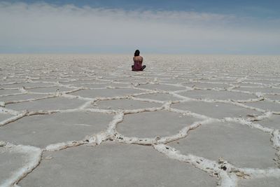 Rear view of woman on salt basin