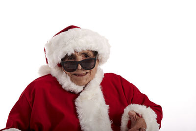 Portrait of man with red hat against white background