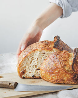 Cropped hand of person preparing food