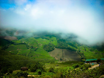 Scenic view of mountains against cloudy sky