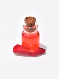 Close-up of glass of jar against white background