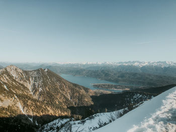 Scenic view of snowcapped mountains against clear sky