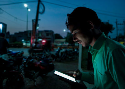 Portrait of young man using mobile phone