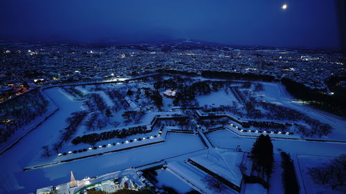 High angle view of illuminated cityscape