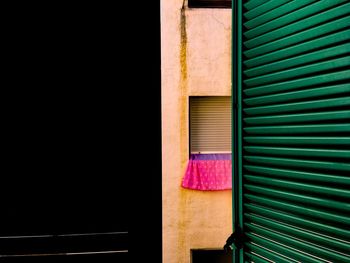 Close-up of shutter against building