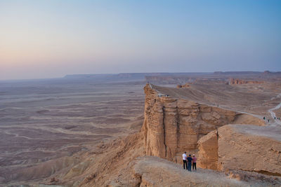 People standing on cliff