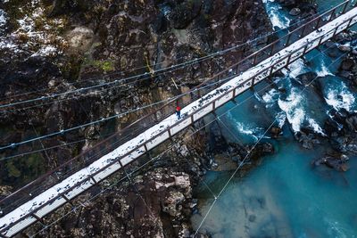 High angle view of bridge amidst trees during winter