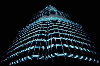 Low angle view of skyscraper at night