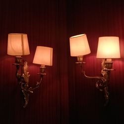 Close-up of electric lamp against wall at home