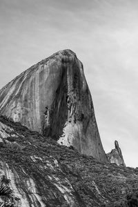 Low angle view of rock formations against sky