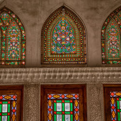 Full frame shot of stained glass in building