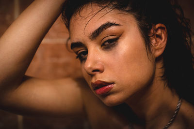 Close-up portrait of young woman looking away