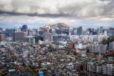 High angle view of buildings in city against sky