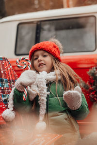 Portrait of smiling young woman in car