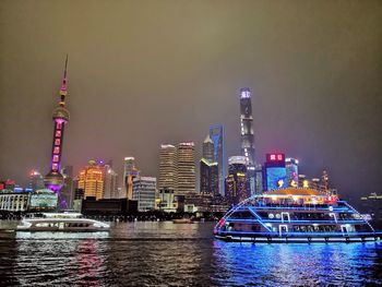 Illuminated buildings in city at night