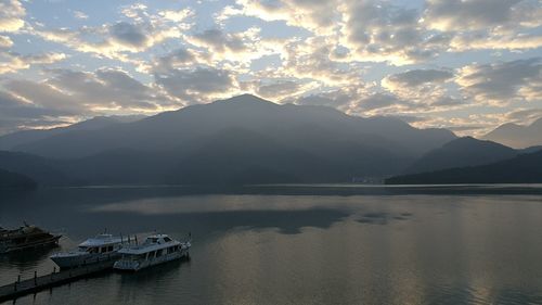 Scenic view of lake against sky during sunset