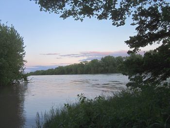 Scenic view of lake against sky during sunset