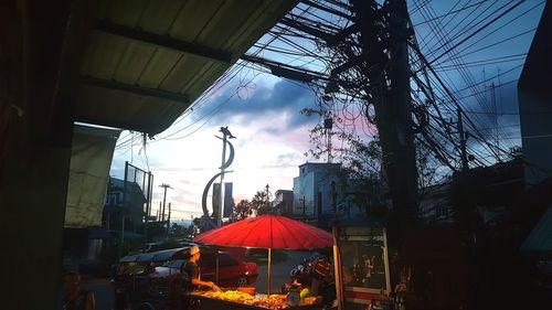 Low angle view of illuminated buildings against sky