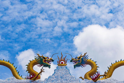 Low angle view of statue against sky