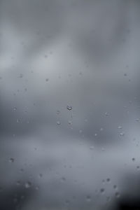 Full frame shot of raindrops on glass window