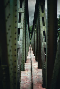 Narrow footpath along bridge