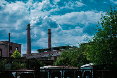 Low angle view of factory against sky