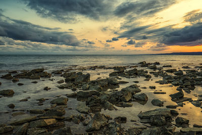 Scenic view of sea against sky during sunset