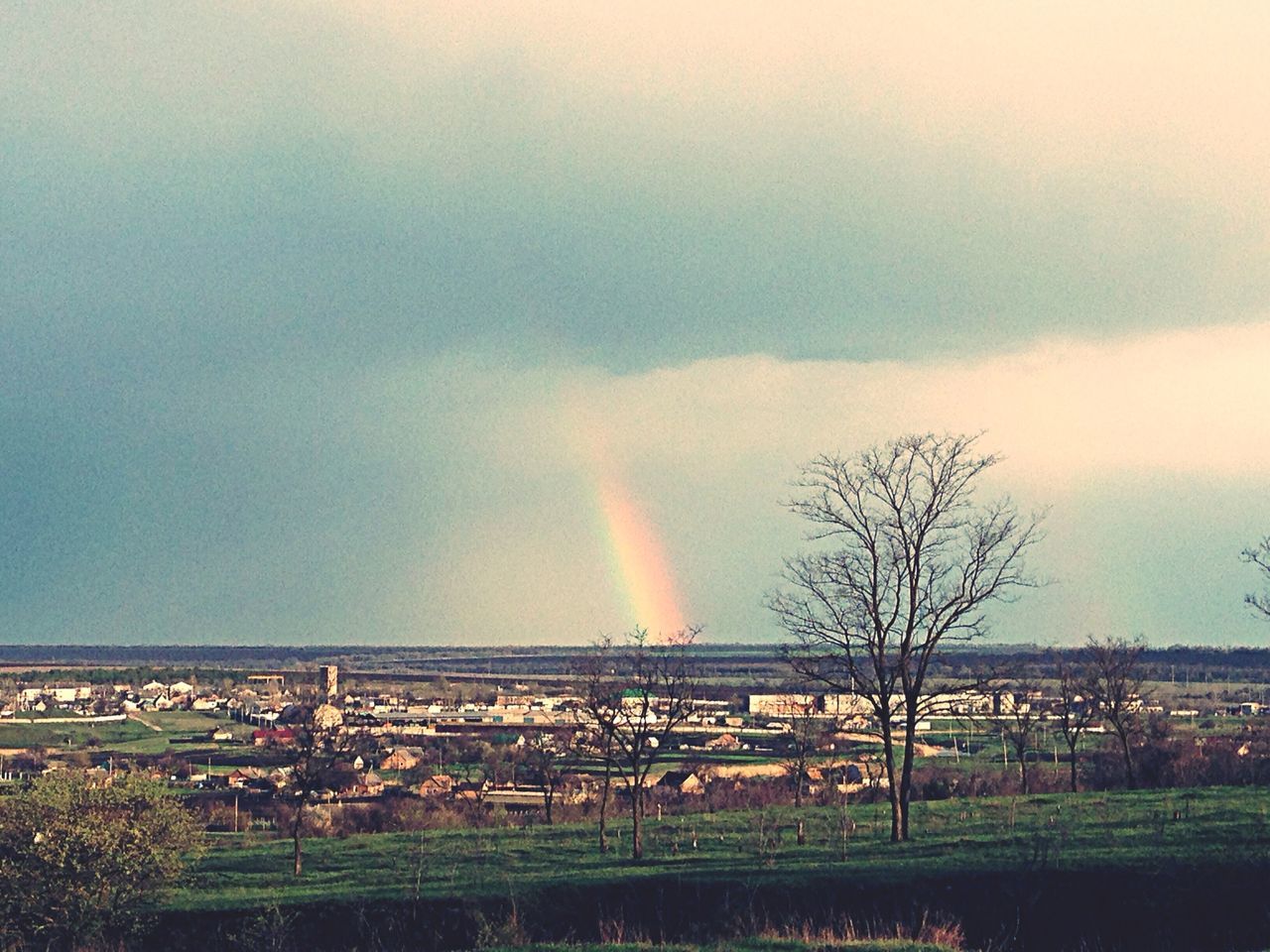 landscape, sky, field, rainbow, scenics, tree, tranquil scene, tranquility, beauty in nature, grass, nature, cloud - sky, built structure, sunset, idyllic, architecture, outdoors, dusk, building exterior, rural scene